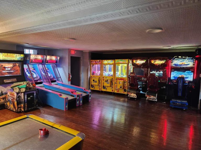 Arcade area at MaxAiir inflatapark with Fast and the Furious racing games, claw machines, and skeeball machines in Marion, Ohio