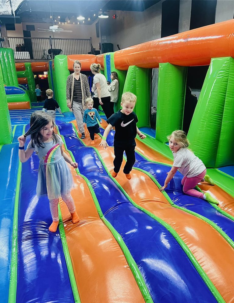 “Group of kids laughing and bouncing together on the jump pad at MaxAiir inflatapark in Marion, Ohio